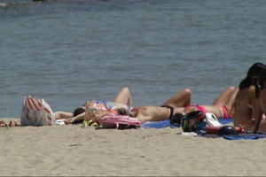 Girls on a nude beach in Sitges, Spain