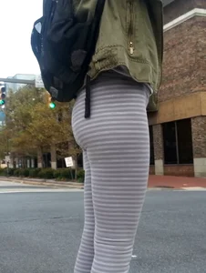 College girl in striped leggings walking with nice ass