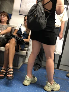 Candid girl in a short dress with muscly legs subway train creepshot