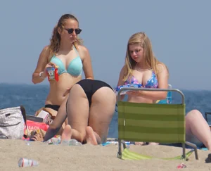 3 girls on the beach in bikinis with big boobs, one brunette and two blondes