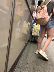 Girl with Hot Muscular Legs in Jeans Shorts Subway Creepshots