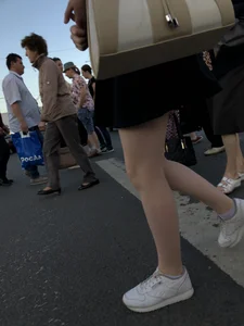 Candid girl wearing a short skirt crossing the street, awesome pale legs