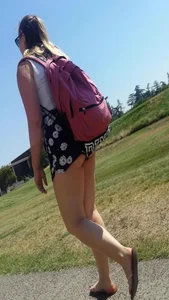 Girl in Shorts and Slippers Candid Photo