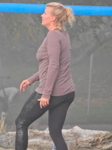 Beach volleyball blonde lady in tight leggings