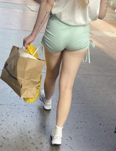 Sexy blonde in green shorts