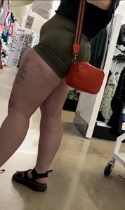 Juicy brunette in green spandex shorts OC