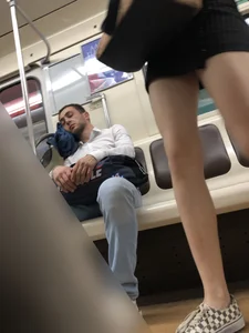 Candid Girl With Hot Long Crossed  Legs Sitting in a Subway Train Creepshots Gallery