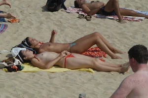 Topless girls on a beach in Barcelona