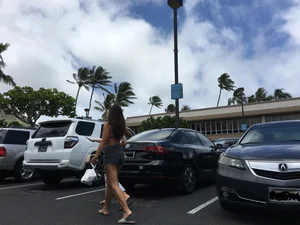 Girl with a nice ass in shorts in the parking lot showing her bikini line