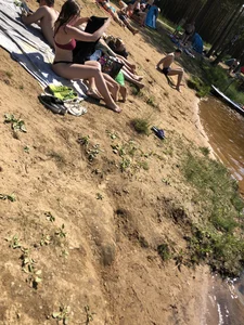 Hot Candid Girls Lying on the Beach in Swimsuits Gallery