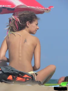 Sexy girls going topless at the beach showing off their sexy bodies
