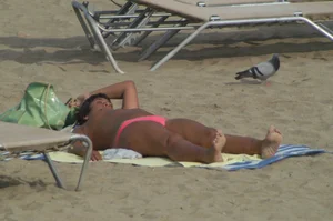 Topless girls on a beach in Barcelona