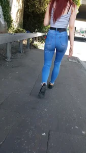 Redhead with a nice ass in tight jeans walking