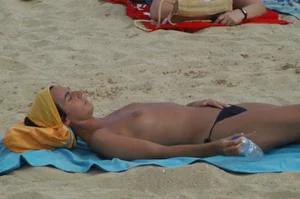 Topless girls on a beach in Barcelona