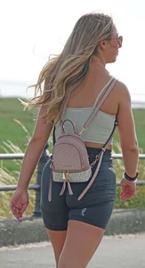 Blonde woman in lycra shorts - good front view, back view ruined by a bag