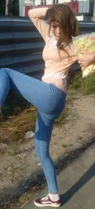 Teen in Tight Blue Jeans Raising Her Legs