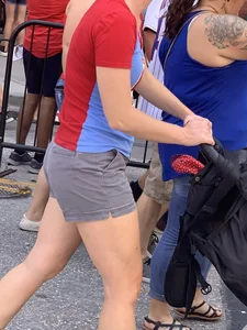 Bunch of girls in various outfits at a Cardinals baseball game