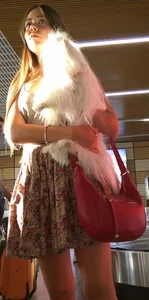 Girl in Flowery Dress with Sexy Thin Legs and a Cute Dog in Her Hands Airport Candid