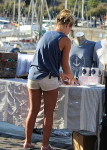 Sexy blonde girl in short white shorts