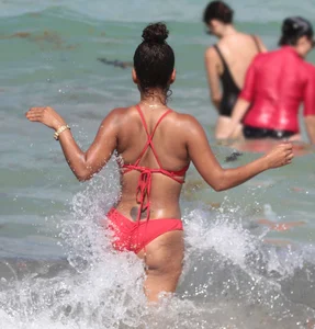 Christina Milian in red bikini in Miami with hard nipples