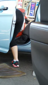 Girl in tight see through leggings with nice ass cleaning her car