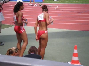 Hot Female Athlete Adjusting Uniform Flashing Ass