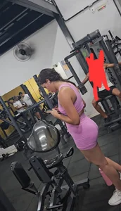 Hot Brazilian woman in pink outfit at the gym