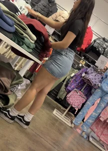 Cute salesgirl with tight Jean skirt showing some legs (OC)