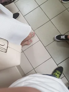 Feet in High Heeled Shoes in a College Hallway Creepshot