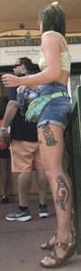 Tatted up hippie in short jean shorts with a nip slip