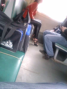 Candid Girl in Tight Leather Pants And High-Heeled Shoes Public Train Photo