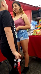 Latin teen with cute braces in shorts…