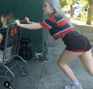 Cute Teen in Mini-Shorts Pushing a Trolley with Another Teen inside Candid