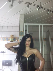 Girl in a Leather Corset, Selfie in Bathroom