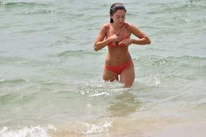 Two sexy ass girls on the beach in bikinis