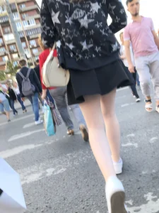 Candid girl wearing a short skirt crossing the street, awesome pale legs