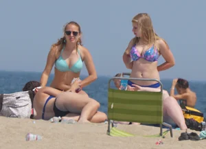 3 girls on the beach in bikinis with big boobs, one brunette and two blondes