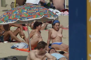 Topless girls on a beach in Barcelona