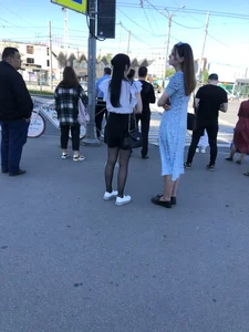 Skinny candid teen wearing shorts and black pantyhose crossing the street