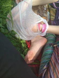 Bare Foot of a Candid Girl Sitting on Grass