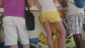 Milf in yellow shorts with vpl and a wedgie
