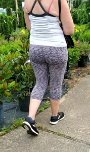 Milf booty in tight leggings shopping for plants