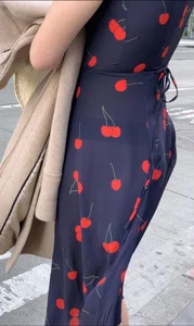 Business women with a visible thong in a see through Cherry Dress