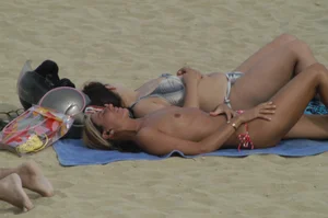 Topless girls on a beach in Barcelona