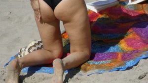 Black semi thong babe laying out with a nice ass