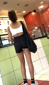 hot petite Indian chick showing some T&A in skimpy workout clothes