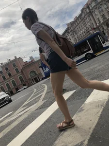 Young Girl in Shorts And Sandals Crossing the Street Gallery