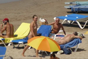 Girls on a nude beach in Sitges, Spain