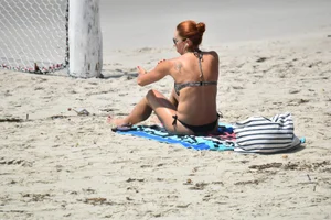Redhead with nice tits in a bikini on the beach