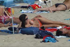 Girls on a nude beach in Sitges, Spain